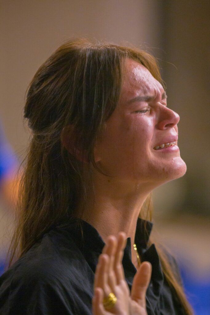 woman experiencing peace through prayer and a strong relationship with Jesus
